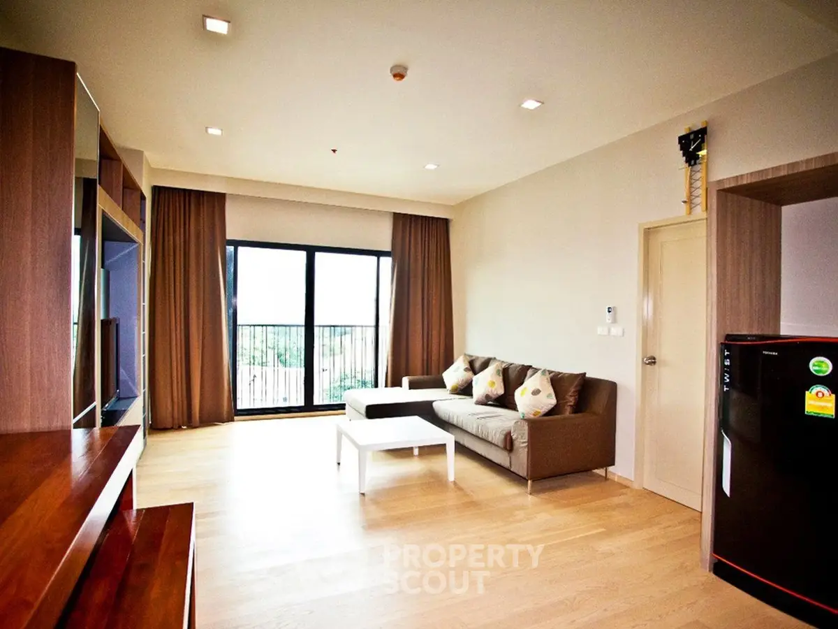 Spacious modern living room with large windows and elegant decor