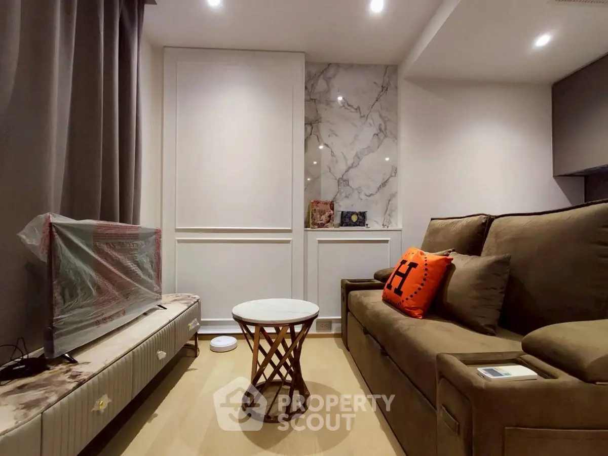 Cozy living room with modern decor and marble accent wall