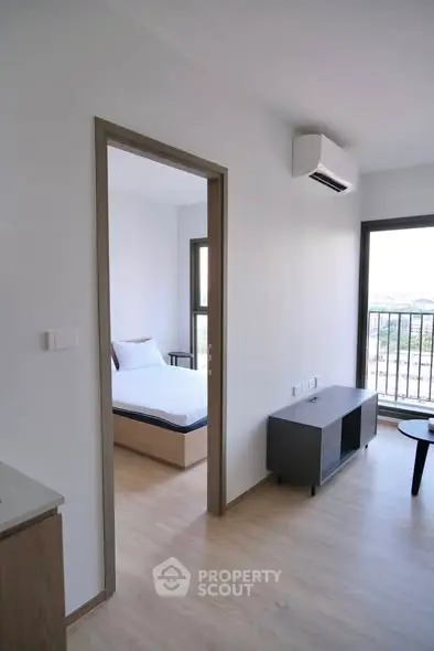 Modern apartment interior with bedroom and balcony view