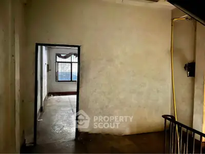 Spacious interior with natural light and potential for renovation.