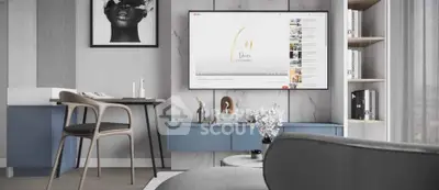 Modern living room with stylish decor and wall-mounted TV, featuring sleek furniture and contemporary design.