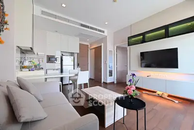 Modern living room with sleek furniture and open kitchen layout