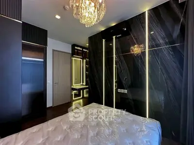 Luxurious modern bedroom with elegant lighting and sleek black accents.