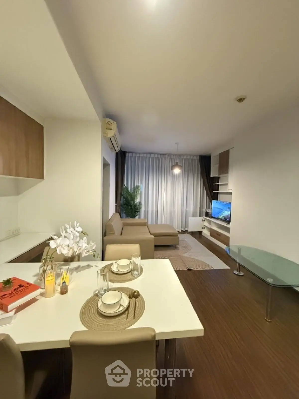 Modern living room with stylish decor and open dining area