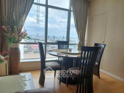 Chic dining area with stunning city view, featuring elegant wooden furniture and floor-to-ceiling windows.