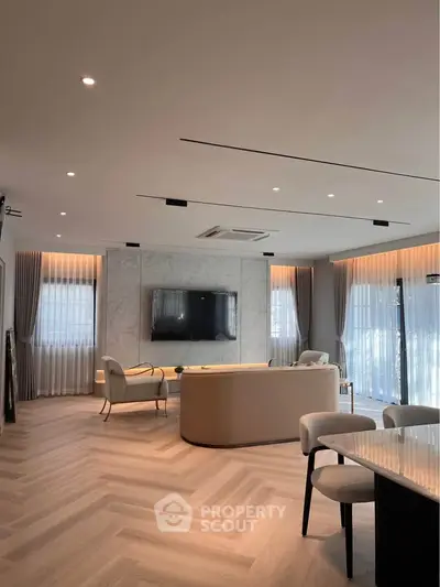 Luxurious modern living room with elegant decor and large windows