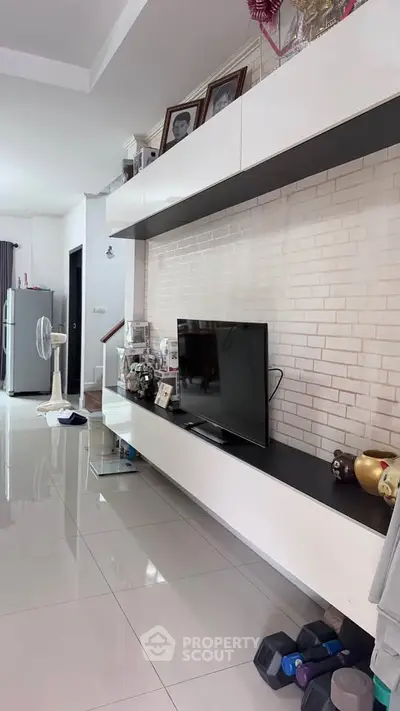 Modern living room with sleek TV unit and stylish decor