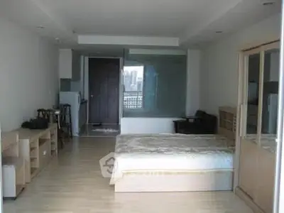 Spacious studio apartment with modern furnishings and city view