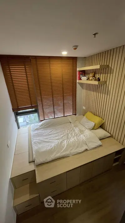 Cozy modern bedroom with wooden accents and built-in storage