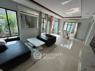 Spacious modern living room with elegant decor and abundant natural light
