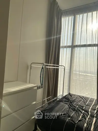 Cozy bedroom with natural light and modern furnishings