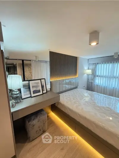 Modern bedroom with stylish decor and ambient lighting