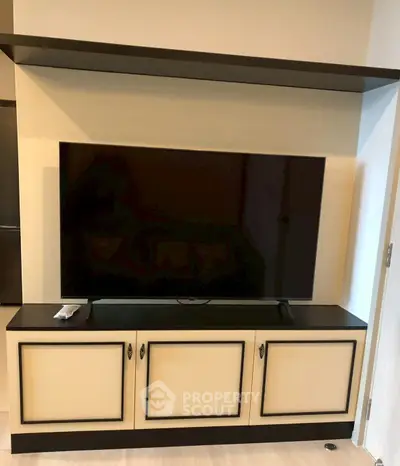 Modern living room with sleek TV unit and stylish cabinetry
