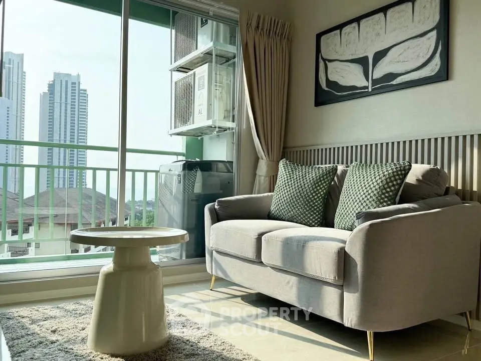 Chic living room with cozy sofa, modern decor, and city view balcony.