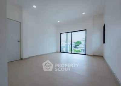 Spacious empty living room with large window and modern design