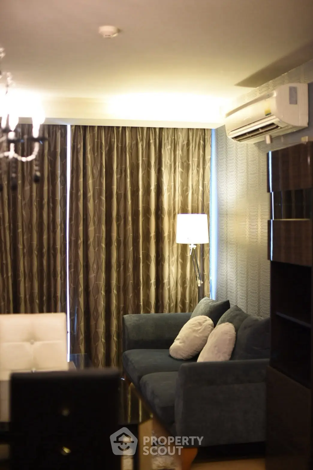 Cozy living room with elegant sofa and modern lighting