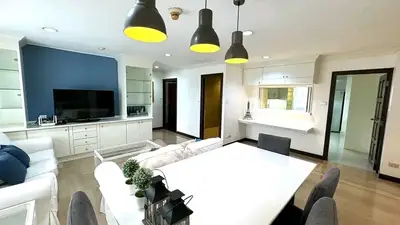 Spacious modern living room with dining area and stylish lighting