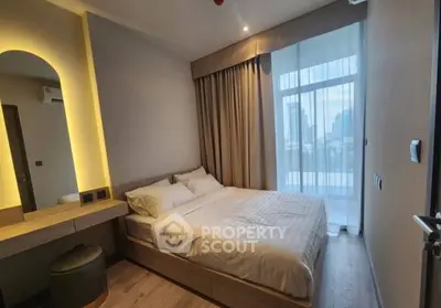 Modern bedroom with city view, featuring cozy bed and elegant lighting.