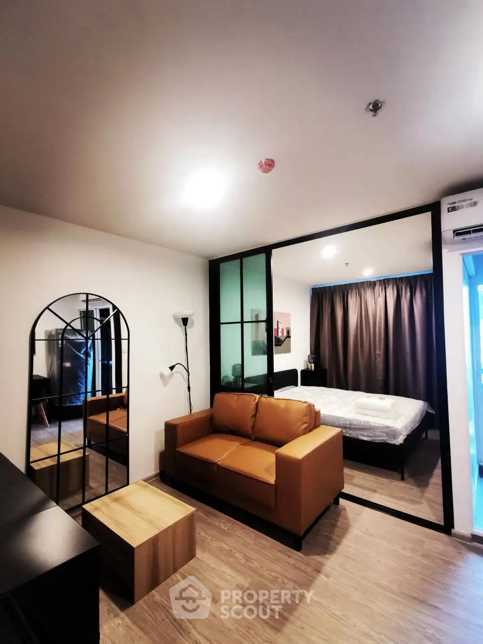 Modern studio apartment with stylish decor and cozy living area.