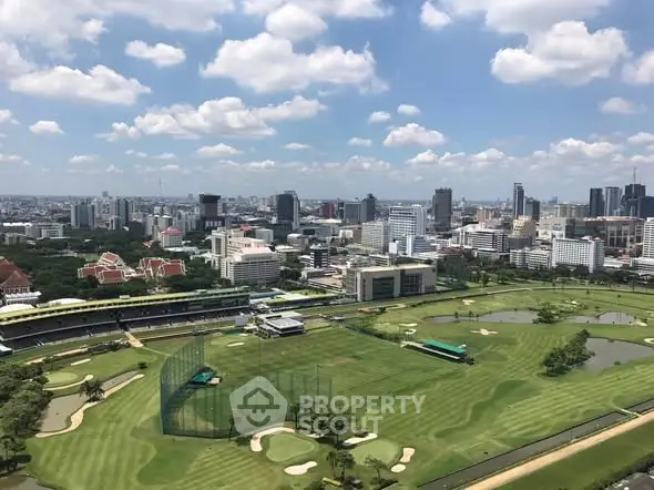 Stunning cityscape view overlooking a lush golf course with skyline backdrop, perfect for urban living enthusiasts.