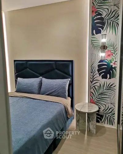Stylish bedroom with modern decor and floral accent wall
