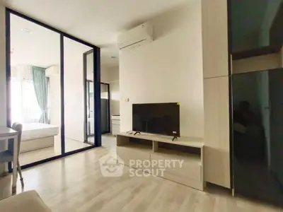 Modern living room with sleek design and large TV