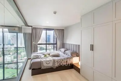 Modern bedroom with city view and elegant decor in high-rise apartment