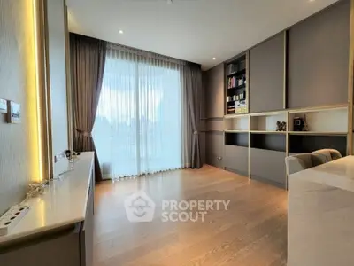 Spacious modern living room with floor-to-ceiling windows and elegant built-in shelving.