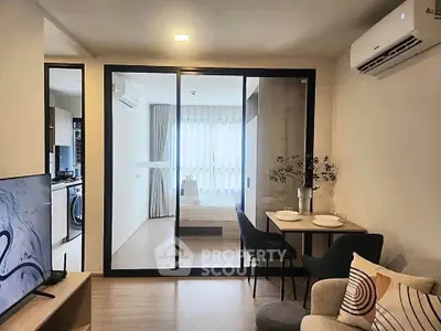 Modern living room with open layout and stylish decor in a cozy apartment.