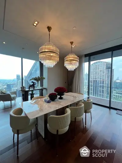 Luxurious dining area with stunning city view and elegant chandeliers