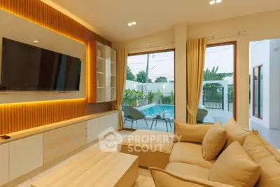 Luxurious living room with pool view and modern decor