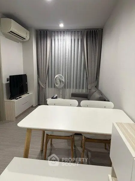 Modern living room with sleek furniture and air conditioning, perfect for cozy gatherings.
