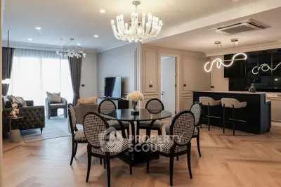 Luxurious open-plan living and dining area with elegant lighting and modern furnishings.