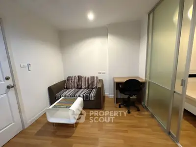 Cozy living room with modern sofa and workspace in stylish apartment
