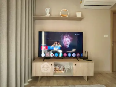 Modern living room with stylish TV setup and elegant decor.