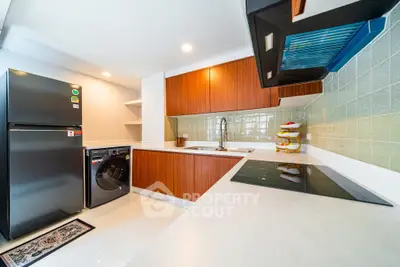 Modern kitchen with sleek appliances and stylish cabinetry
