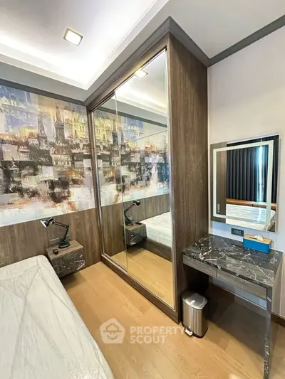 Modern bedroom with mirrored wardrobe and stylish decor