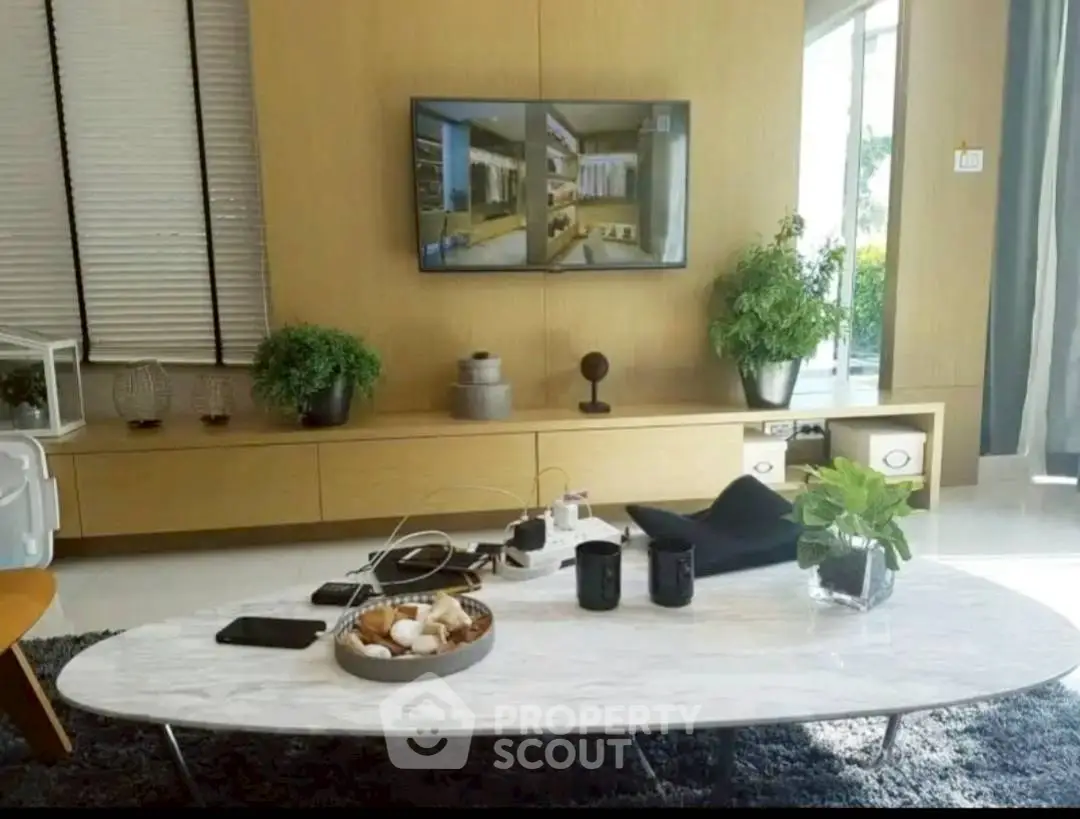 Stylish living room with modern decor and wall-mounted TV