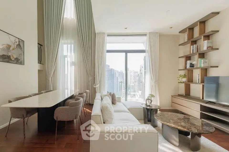 Luxurious living room with floor-to-ceiling windows and city view, elegant furniture and modern decor.