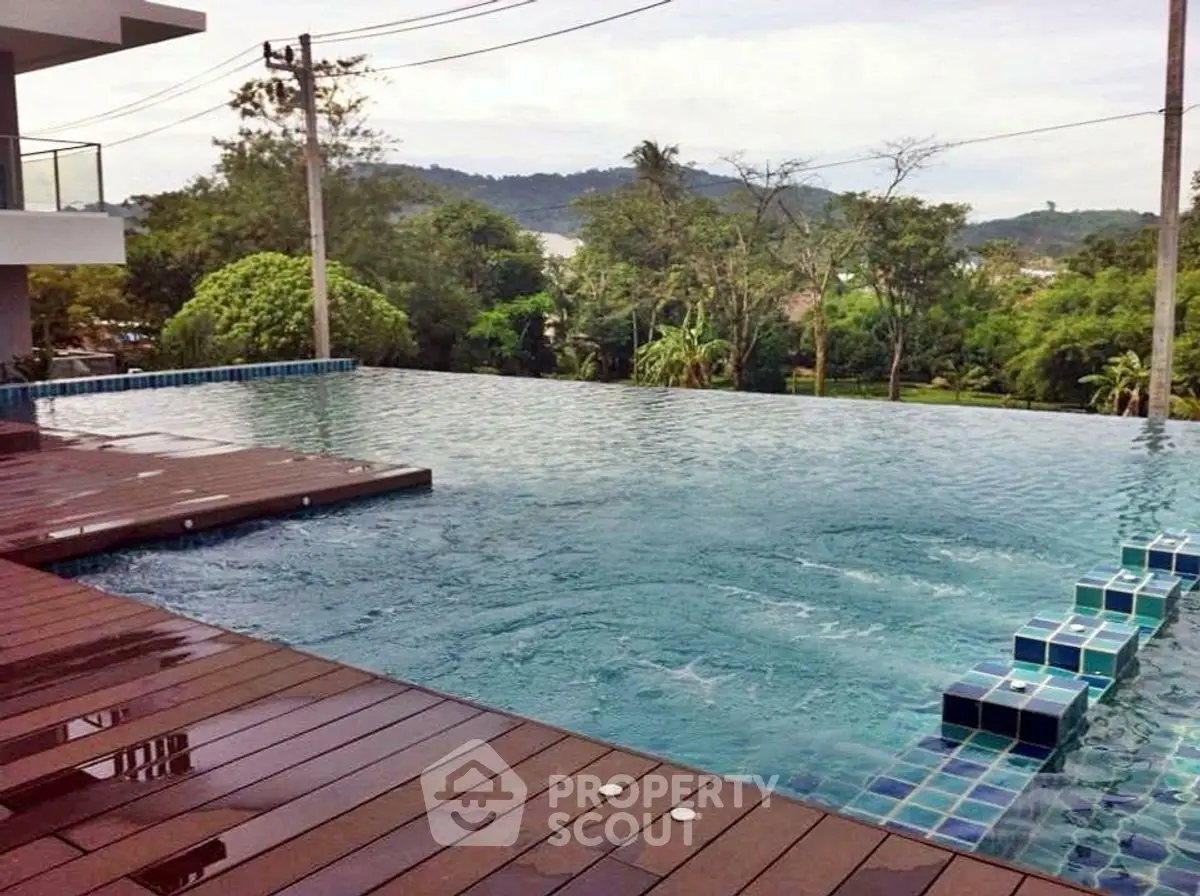 Luxurious infinity pool with stunning scenic views and modern deck area.