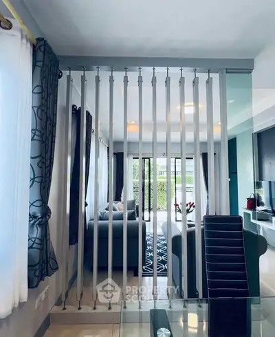 Modern living room with stylish partition and cozy seating area