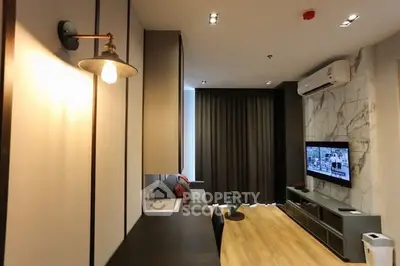 Modern living room with stylish decor and wall-mounted TV