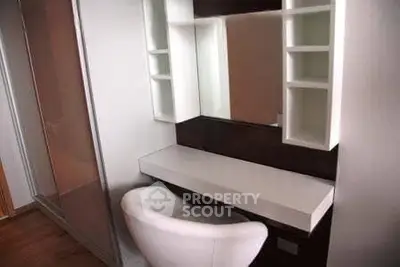 Modern study nook with sleek desk and comfortable chair in stylish apartment.