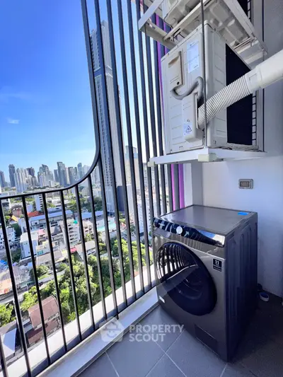High-rise balcony with city view and modern washing machine, perfect for urban living.