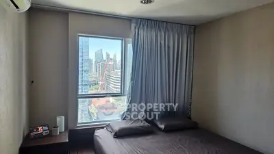 Modern bedroom with city view and sleek decor