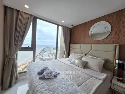 Luxurious bedroom with stunning ocean view and elegant decor