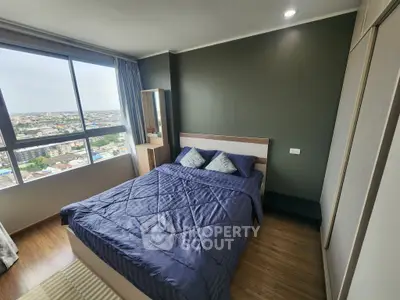 Modern bedroom with stunning city view and cozy decor