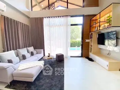 Spacious modern living room with pool view and stylish decor