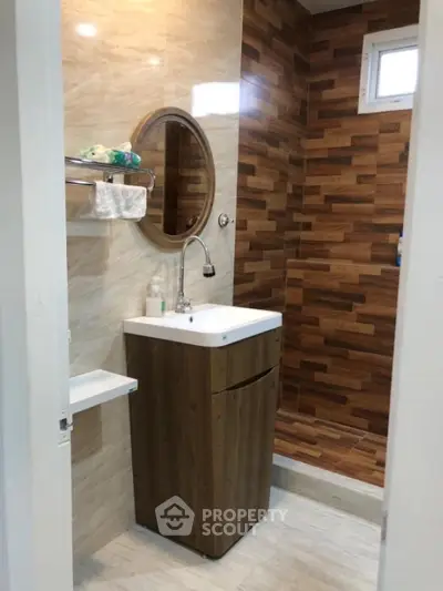 Modern bathroom with stylish wooden accents and sleek sink design