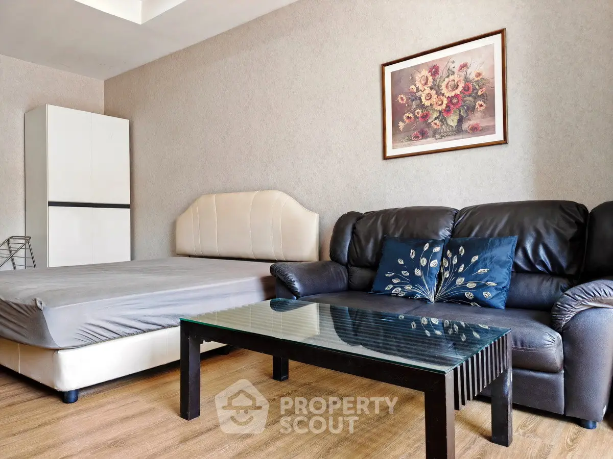 Modern studio apartment with stylish decor and comfortable furnishings.